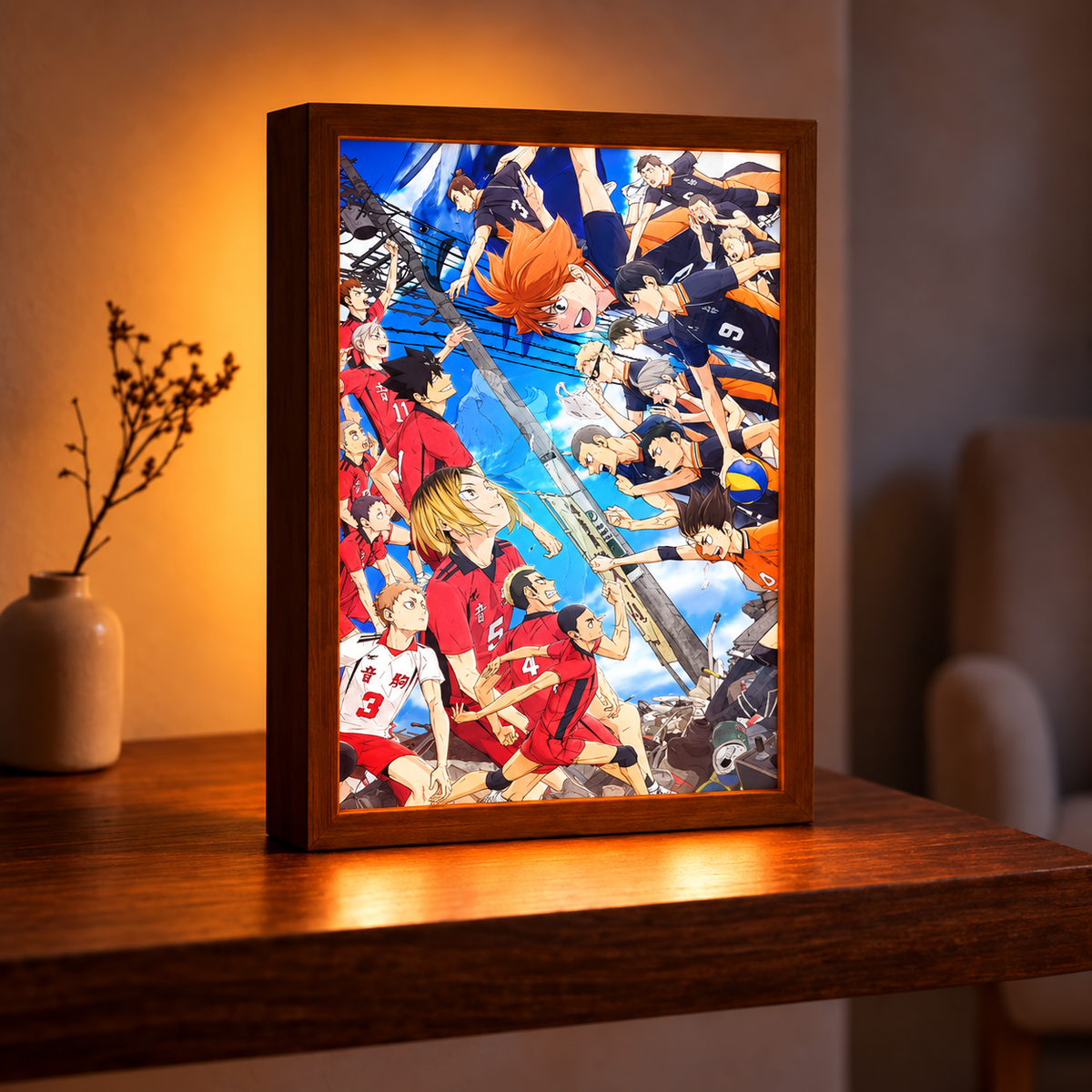 Haikyuu Rivalry illuminated artwork in a wooden frame on a table beside a vase in a warm room