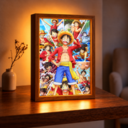 Luffy Adventure illuminated wooden frame with colorful One Piece collage on a wooden table in a warmly lit room