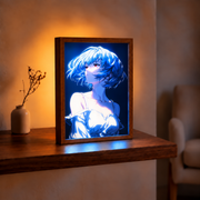 Rei Ayanami illuminated artwork in a wooden frame on a warm-lit shelf