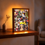 Shinobi Legacy Naruto-inspired illuminated character ensemble in an upright wooden frame on a rustic table beside a beige vase in a warmly lit room