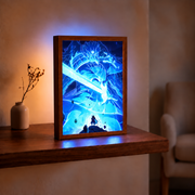 Sword-wielding blue Susanoo above Madara Uchiha, glowing in a wooden frame on a table in a warm room